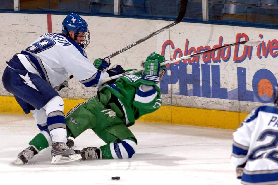 What is cross-checking in hockey?