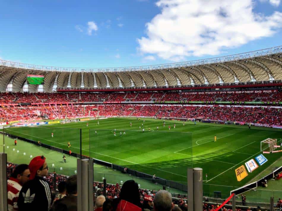 Soccer fan in stadium watch professional soccer game.