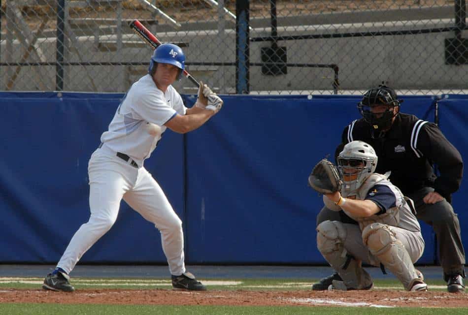 College baseball player takes a pitcher letter-high.