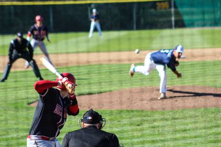 A baseball pitcher throws a pitch.