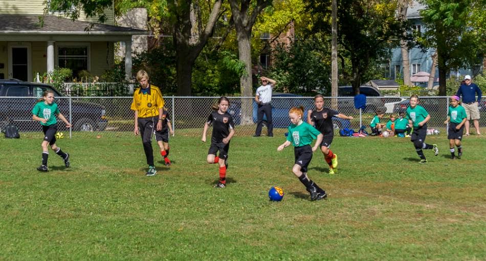 A youth girls soccer game.