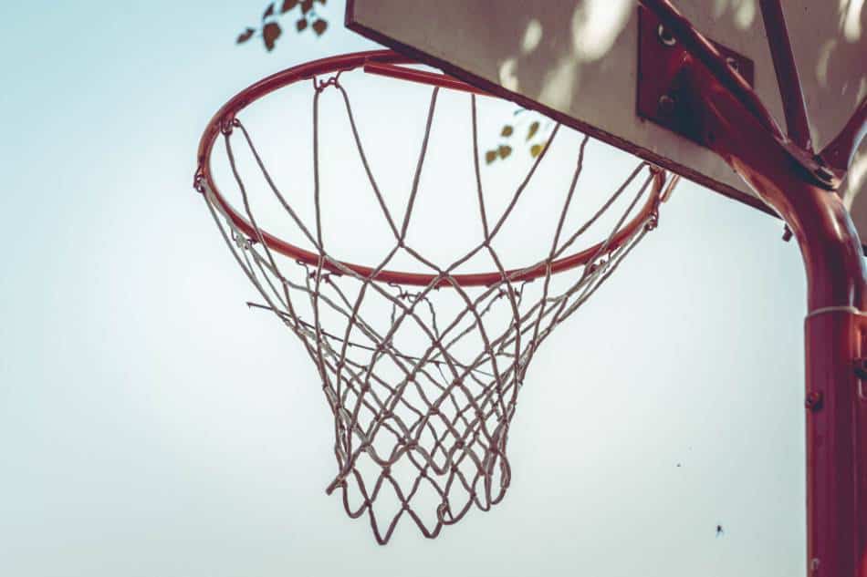 A basketball hoop on an outdoor court.