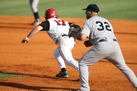 A runner attempts to steal 2nd base.