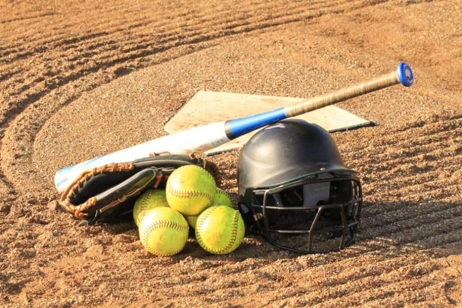 Softball equipment lying near home plate.