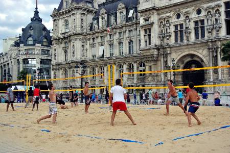 An outdoor beach volleyball game.