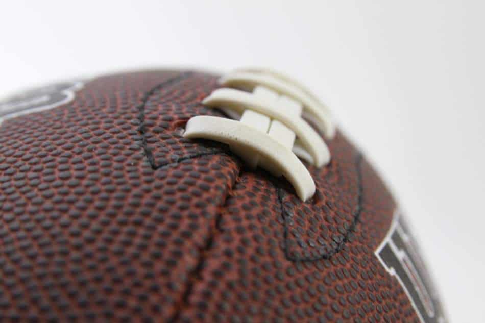 Zoomed in photo of the laces on a football.